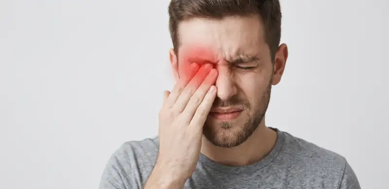 Optometrist examining a patient’s eye